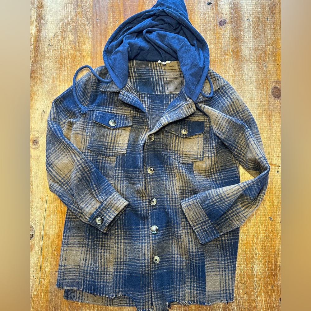 Raw edged shacket with hood.